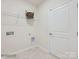 Laundry room with shelving and space for a washer and dryer at 1988 Copper Path Dr, Fort Mill, SC 29715