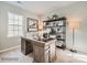 Home office with a large desk, shelving, and window at 1988 Copper Path Dr, Fort Mill, SC 29715