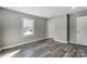 Bright bedroom with wood-look floors and neutral wall colors at 210 Dixie Dr, Kannapolis, NC 28083