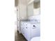 Bathroom vanity with double sinks, granite countertop, and sleek black hardware at 2222 Badin Rd, Albemarle, NC 28001