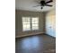 Bedroom with hardwood floors, double windows, and a white closet at 2222 Badin Rd, Albemarle, NC 28001