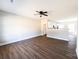 Bright living room featuring dark wood floors and an open layout to the kitchen at 2222 Badin Rd, Albemarle, NC 28001