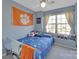 Bedroom with a double bed, Buffalo Bills bedding, and Clemson flag at 224 Butler Pl, Fort Mill, SC 29715