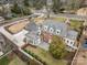 Aerial view of the home with a gray roof, manicured backyard, and charming brick exterior at 2400 Mecklenburg Ave, Charlotte, NC 28205