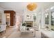 Bright and open living room with a fireplace, large windows, and comfortable seating at 2400 Mecklenburg Ave, Charlotte, NC 28205