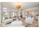 Spacious living room featuring hardwood floors, an open layout, comfortable seating, and ample natural light at 2400 Mecklenburg Ave, Charlotte, NC 28205