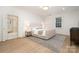 Bright bedroom with hardwood floors, window and access to an ensuite bathroom at 2400 Mecklenburg Ave, Charlotte, NC 28205