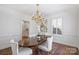 Formal dining room with hardwood floors and a chandelier at 2538 Roswell Ave, Charlotte, NC 28209