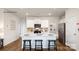 Modern kitchen with white cabinets, island, and stainless steel appliances at 301 Brinkley Dr, Kings Mountain, NC 28086