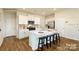 Modern kitchen featuring white cabinetry, stainless steel appliances, and an island with bar stool seating at 301 Brinkley Dr # Lot 103, Kings Mountain, NC 28086