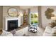 Cozy living room with fireplace, neutral decor, and sliding glass doors to the backyard at 301 Brinkley Dr # Lot 103, Kings Mountain, NC 28086
