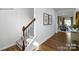 Elegant staircase with a metal railing and hardwood floors at 301 Brinkley Dr # Lot 103, Kings Mountain, NC 28086