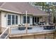 Expansive back deck features plenty of seating with an outdoor kitchen and dining area for entertaining at 302 Mccrary Rd, Mooresville, NC 28117