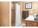 Small bathroom with shower and wood vanity at 302 Mccrary Rd, Mooresville, NC 28117