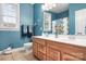 Bathroom with double vanity, wood cabinets, and a shower/tub combo at 302 Mccrary Rd, Mooresville, NC 28117
