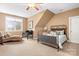 Bedroom with chaise lounge, desk, and a metal bed frame at 302 Mccrary Rd, Mooresville, NC 28117