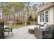 Back deck with seating, a table, and wooded views at 302 Mccrary Rd, Mooresville, NC 28117
