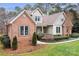 Brick and siding home with partial view of the front yard at 302 Mccrary Rd, Mooresville, NC 28117