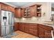 Kitchen with stainless steel refrigerator and wood cabinets at 302 Mccrary Rd, Mooresville, NC 28117