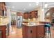 Kitchen with island, stainless steel appliances, and wood cabinets at 302 Mccrary Rd, Mooresville, NC 28117