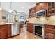 Kitchen with stainless steel appliances and view into Gathering room at 302 Mccrary Rd, Mooresville, NC 28117
