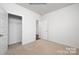 Spacious bedroom with neutral carpeting and a sizable closet at 307 Brinkley Dr, Kings Mountain, NC 28086