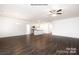 Open living space with kitchen, hardwood floors and ceiling fan at 307 Brinkley Dr, Kings Mountain, NC 28086
