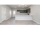 Open kitchen with dark cabinets and breakfast bar at 336 D Lincoln St, Concord, NC 28025