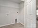 Bright laundry room with wire shelving and vinyl flooring at 336 D Lincoln St, Concord, NC 28025