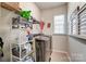 Laundry room with washer, dryer, and storage shelving at 4063 Whittier Ln, Fort Mill, SC 29708