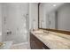 Elegant bathroom with marble vanity, walk-in shower, and modern fixtures at 413 Eastover Rd, Charlotte, NC 28207