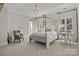 Bedroom with four-poster bed, carpeting, and window seating at 413 Eastover Rd, Charlotte, NC 28207
