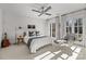 Bright bedroom with double doors, plush bed, and ample natural light at 413 Eastover Rd, Charlotte, NC 28207