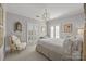 Bedroom with antique chair, hardwood floors, and window shutters at 413 Eastover Rd, Charlotte, NC 28207