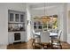 Breakfast nook with a built-in banquette and a charming window at 413 Eastover Rd, Charlotte, NC 28207