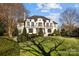 Elegant home with a large front yard and mature trees at 413 Eastover Rd, Charlotte, NC 28207