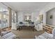 Gathering room with light colored sofas, a coffee table, and kitchen views at 413 Eastover Rd, Charlotte, NC 28207