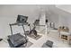 Home gym with Peloton bike and treadmill at 413 Eastover Rd, Charlotte, NC 28207