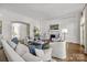 Spacious living room with hardwood floors, fireplace, and access to hallway at 413 Eastover Rd, Charlotte, NC 28207