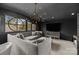 Dark-walled media room featuring a sectional sofa and large TV at 413 Eastover Rd, Charlotte, NC 28207