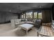 L-shaped sectional sofa dominates this dark-walled media room at 413 Eastover Rd, Charlotte, NC 28207