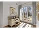Sunlit home office features antique desk and French doors to balcony at 413 Eastover Rd, Charlotte, NC 28207