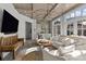 Spacious recreation room with large TV, comfortable seating and wet bar at 413 Eastover Rd, Charlotte, NC 28207