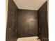 Bathroom with dark slate tile shower surround at 4718 Americana Ave, Charlotte, NC 28215