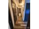 Hallway with dark doors and wood-look flooring at 4718 Americana Ave, Charlotte, NC 28215