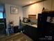 Kitchen with dark cabinets, granite countertops, and stainless steel appliances at 4718 Americana Ave, Charlotte, NC 28215