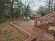 Brick patio with seating area, surrounded by landscaping at 4718 Americana Ave, Charlotte, NC 28215