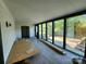 Sunroom addition with wall-to-wall windows and backyard access at 4718 Americana Ave, Charlotte, NC 28215