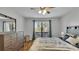 Spacious bedroom with wood floors and large window at 5020 Sardis Rd # I, Charlotte, NC 28270