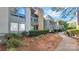 Exterior view of a condo building with walkway and landscaping at 5020 Sardis Rd # I, Charlotte, NC 28270